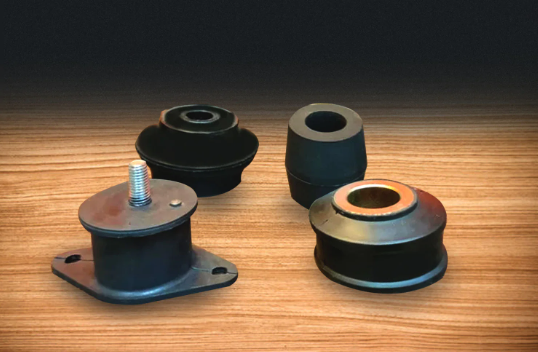 Inspection comparison showing normal rubber deflection, torn rubber, bond separation, sleeve movement, and a loose mounting bracket