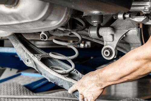Cost comparison showing an accessible steering rack bushing repair, a difficult-access bushing repair, and complete steering rack replacement