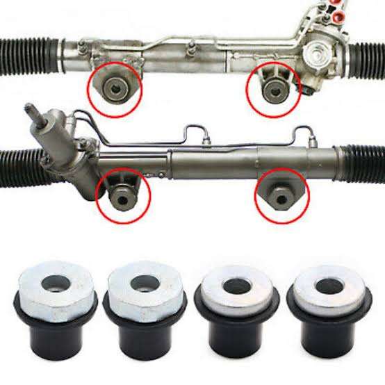 Exploded service-access diagram showing rack clamps, bushings, mounting bolts, subframe, steering shaft, hydraulic lines, and EPS connectors